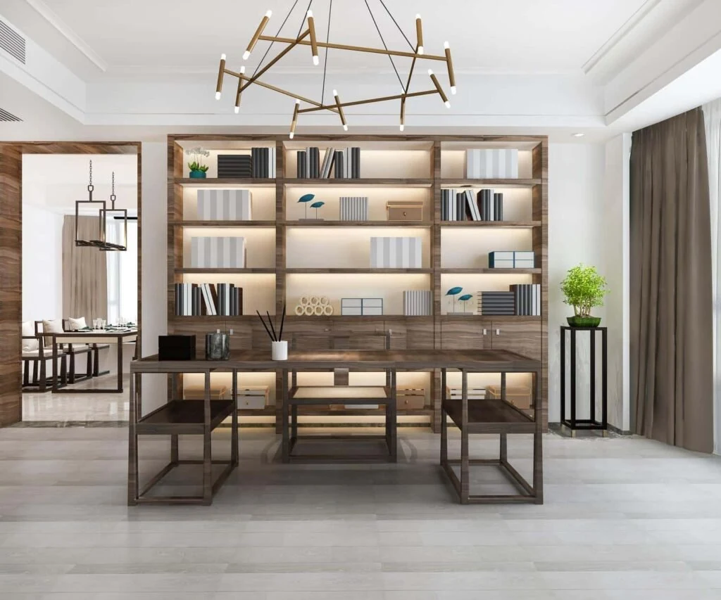 Shared workspace with a long desk and wall shelving