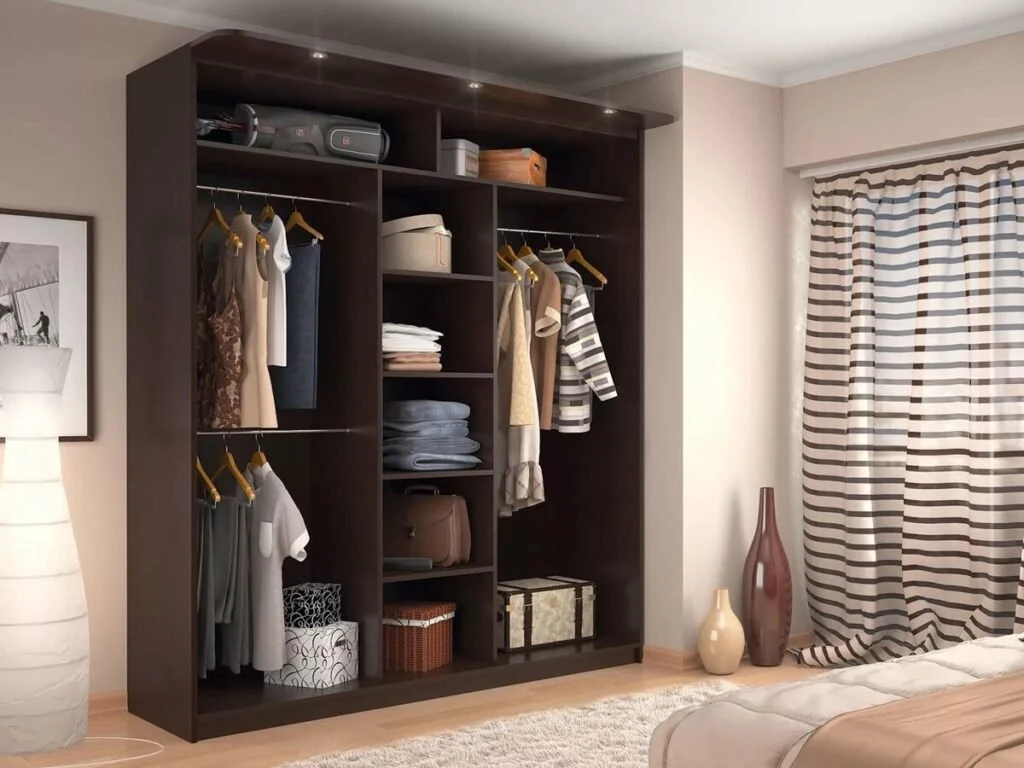 Dark wood wardrobe with open hanging space and drawers