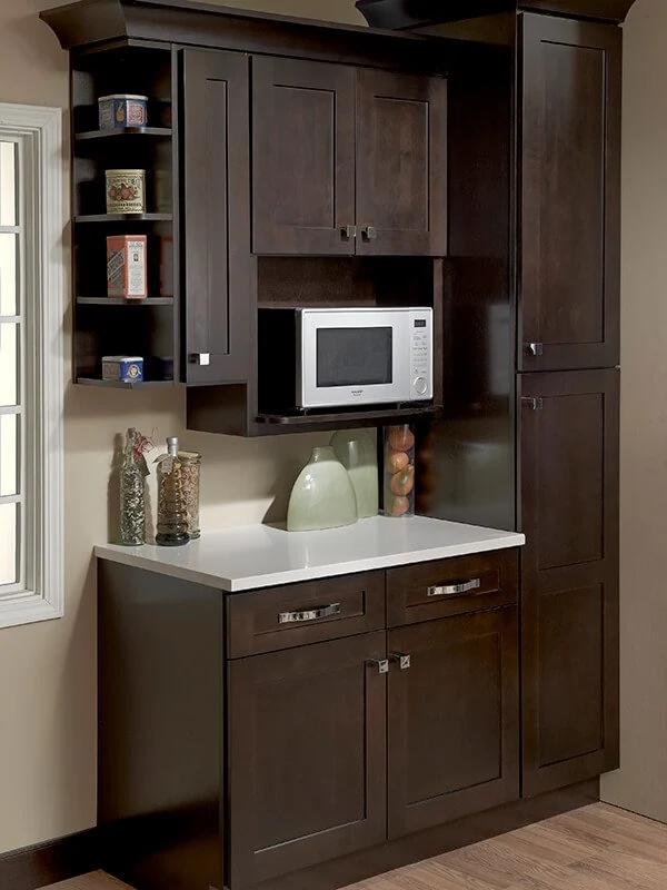 Dark cabinet storage with an open counter and appliance shelves